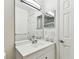 Bathroom featuring a modern vanity, mirrored cabinet, and updated fixtures at 3335 Fox Hunt Dr, Palm Harbor, FL 34683