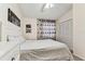 Cozy bedroom with a white bed, soft lighting, and floral curtains at 3335 Fox Hunt Dr, Palm Harbor, FL 34683