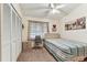 Inviting bedroom with striped bedding, a closet, and soft natural light at 3335 Fox Hunt Dr, Palm Harbor, FL 34683
