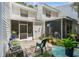 Private outdoor patio surrounded by lush greenery and mature trees at 3335 Fox Hunt Dr, Palm Harbor, FL 34683