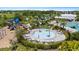 Community splash pad, pool and lounge chairs, perfect for enjoying the outdoors at 33369 Hamilton Hill Ln, Wesley Chapel, FL 33545