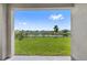 Enjoy this backyard view with lush green grass and a peaceful pond at 33369 Hamilton Hill Ln, Wesley Chapel, FL 33545