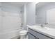 Bathroom boasts a shower-tub combination, a white toilet and a vanity with a granite countertop at 33369 Hamilton Hill Ln, Wesley Chapel, FL 33545