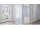 Hallway features a patterned glass front door and two interior doors at 33369 Hamilton Hill Ln, Wesley Chapel, FL 33545