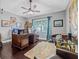Office with wood floors, large window and a decorative desk at 34811 Arbor Green Pl, Zephyrhills, FL 33541