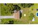 Aerial view of property featuring a fenced yard, mature trees and a driveway at 3513 Syracuse St, Port Charlotte, FL 33952