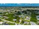 Scenic aerial view of the property with a beautiful neighborhood and homes nearby at 3513 Syracuse St, Port Charlotte, FL 33952