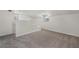 Upper bonus area features built-in steps, carpeting, and natural light at 3513 Syracuse St, Port Charlotte, FL 33952