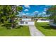 Attractive two-story home with a well-kept lawn and a clear view of the front facade at 3513 Syracuse St, Port Charlotte, FL 33952
