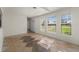 Spacious living room with tiled floors and large windows bringing in plenty of natural light at 3513 Syracuse St, Port Charlotte, FL 33952
