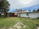 Backyard with mature trees and lawn at 425 49Th N St, St Petersburg, FL 33710