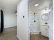 Updated bathroom featuring a glass shower and stylish vanity, offering modern convenience and a clean aesthetic at 425 49Th N St, St Petersburg, FL 33710