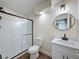 Bathroom features tile floors, a vanity with a quartz countertop and a black-framed shower stall at 425 49Th N St, St Petersburg, FL 33710