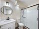 Bathroom features tile floors, a vanity with a quartz countertop and a black-framed shower stall at 425 49Th N St, St Petersburg, FL 33710