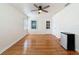 Bedroom featuring hardwood floors, natural light, a ceiling fan, and a mini-refrigerator at 425 49Th N St, St Petersburg, FL 33710