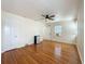 Spacious bedroom with wood floors, a ceiling fan, and two doors at 425 49Th N St, St Petersburg, FL 33710