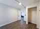 Bedroom has wood-look floors, neutral walls, a small storage shelf and a closet with a rod at 425 49Th N St, St Petersburg, FL 33710