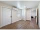 Bedroom features wood-look floors, neutral walls and trim, plus lots of room for storage at 425 49Th N St, St Petersburg, FL 33710