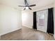 Bedroom with wood-look floors, a modern ceiling fan, and access to the backyard through a glass door at 425 49Th N St, St Petersburg, FL 33710