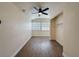 Bedroom with ceiling fan, wood-look flooring, closet with wire shelving, and window with blinds at 425 49Th N St, St Petersburg, FL 33710