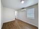 Bedroom features wood-look floors, neutral walls and trim, plus lots of natural light at 425 49Th N St, St Petersburg, FL 33710