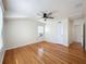 Bright bedroom featuring hardwood floors, a ceiling fan, and multiple closets at 425 49Th N St, St Petersburg, FL 33710