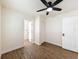 Bright bedroom with hardwood floors, ceiling fan, and closet at 425 49Th N St, St Petersburg, FL 33710