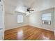 Spacious bedroom with hardwood floors, ceiling fan and ample natural light at 425 49Th N St, St Petersburg, FL 33710