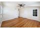 Bedroom featuring hardwood floors, multiple closets, a ceiling fan, and natural light at 425 49Th N St, St Petersburg, FL 33710