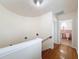 Hallway leading to a bathroom with tiled flooring and updated features at 425 49Th N St, St Petersburg, FL 33710