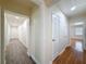 Hallway offers wood-look floors and lots of options for bedrooms and bathrooms at 425 49Th N St, St Petersburg, FL 33710