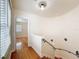 Hallway with hardwood floors leading to room with bright natural light at 425 49Th N St, St Petersburg, FL 33710