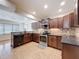 Updated kitchen featuring stainless steel appliances, stone countertops, and an eat-in area at 425 49Th N St, St Petersburg, FL 33710