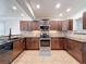 Kitchen with stainless steel appliances, granite countertops, and tile backsplash at 425 49Th N St, St Petersburg, FL 33710