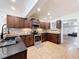 Kitchen showcasing granite countertops, tile backsplash, and stainless steel appliances at 425 49Th N St, St Petersburg, FL 33710