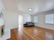 Bright living room with hardwood floors, a fireplace, and a comfortable seating arrangement at 425 49Th N St, St Petersburg, FL 33710