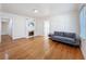 Spacious living room featuring hardwood floors, fireplace, and neutral wall paint at 425 49Th N St, St Petersburg, FL 33710