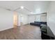 Living room featuring hardwood floors, neutral paint, natural light and a grey sofa at 425 49Th N St, St Petersburg, FL 33710
