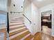 Bright foyer featuring a staircase with wood steps and access to the kitchen at 425 49Th N St, St Petersburg, FL 33710