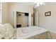 Bedroom with white closet doors, and neutral walls with carpet at 4428 Gevalia Dr, Brooksville, FL 34604