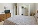Cozy bedroom showcasing carpet, dresser, closet, bed, and window at 4428 Gevalia Dr, Brooksville, FL 34604