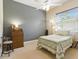 Bedroom features ceiling fan, carpet, window and soft natural light at 4428 Gevalia Dr, Brooksville, FL 34604