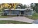 Community clubhouse featuring a welcoming entrance, perfect for gatherings and social events at 4428 Gevalia Dr, Brooksville, FL 34604