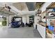 Spacious garage featuring storage units, a golf cart and an abundance of open space at 4428 Gevalia Dr, Brooksville, FL 34604