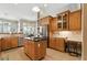 Bright kitchen with an island, breakfast nook, stainless steel appliances, and granite countertops at 4428 Gevalia Dr, Brooksville, FL 34604