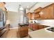 Bright kitchen with granite countertops, custom cabinets, a kitchen island, and stainless steel appliances at 4428 Gevalia Dr, Brooksville, FL 34604