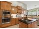 Well-equipped kitchen with stainless steel appliances, custom cabinetry, and granite countertops at 4428 Gevalia Dr, Brooksville, FL 34604