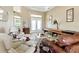 View of a living room featuring comfortable seating, a coffee table, and a shuffleboard table at 4428 Gevalia Dr, Brooksville, FL 34604