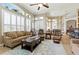Bright and airy living room featuring neutral colors, large windows, and comfortable seating at 4428 Gevalia Dr, Brooksville, FL 34604