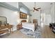 Bright bedroom features hardwood floors, ceiling fan, and art niche at 4428 Gevalia Dr, Brooksville, FL 34604